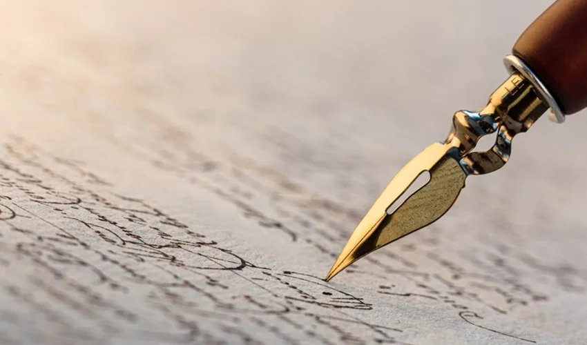 A fountain pen writes elegantly on paper.